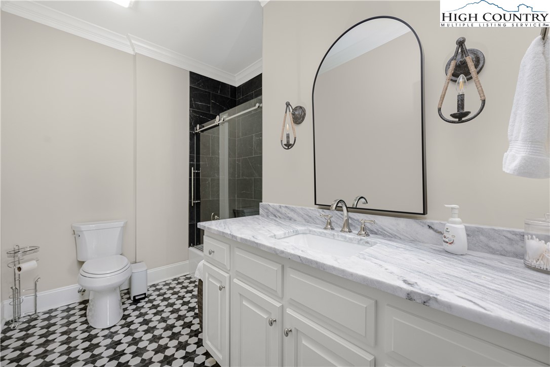 738 Country Club Road Glade Valley, NC 28627 - Photo 33 of 45 a bathroom with a sink and a mirror