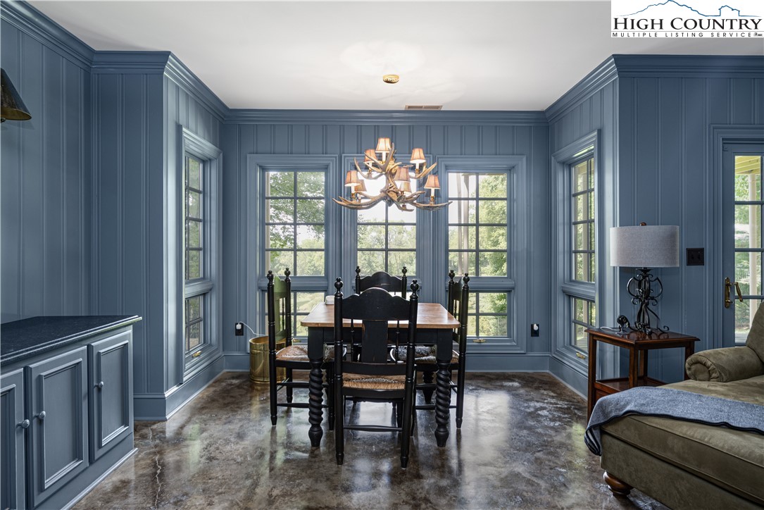 738 Country Club Road Glade Valley, NC 28627 - Photo 35 of 45 a view of a dining room with furniture window and outside view