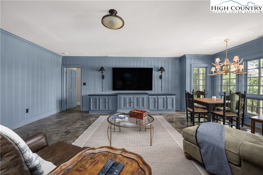 738 Country Club Road Glade Valley, NC 28627 - Photo 36 of 45 a living room with furniture and a flat screen tv