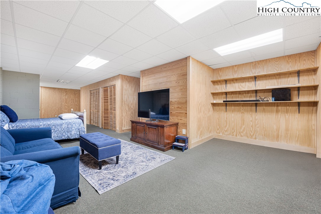 738 Country Club Road Glade Valley, NC 28627 - Photo 40 of 45 a living room with furniture and a flat screen tv