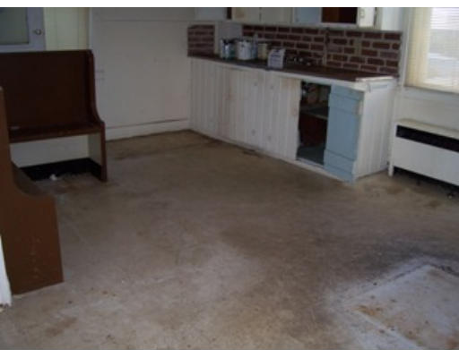 7 Center Street Wareham, MA 02571 - Photo 3 of 13 a kitchen that has a microwave and a stove