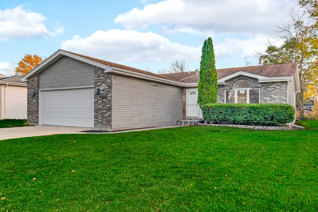 a utility room with multiple dryer and washer