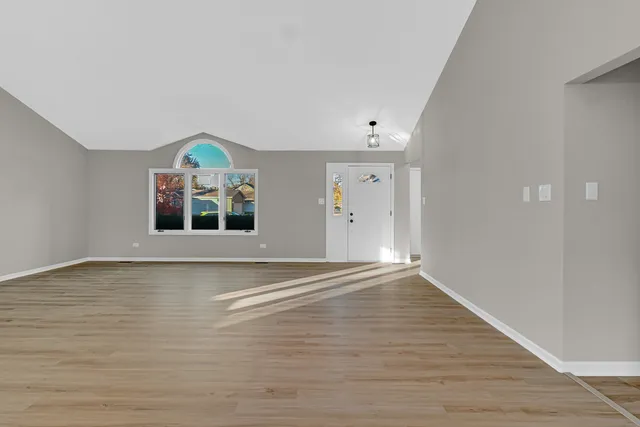 a view of a house with a small yard