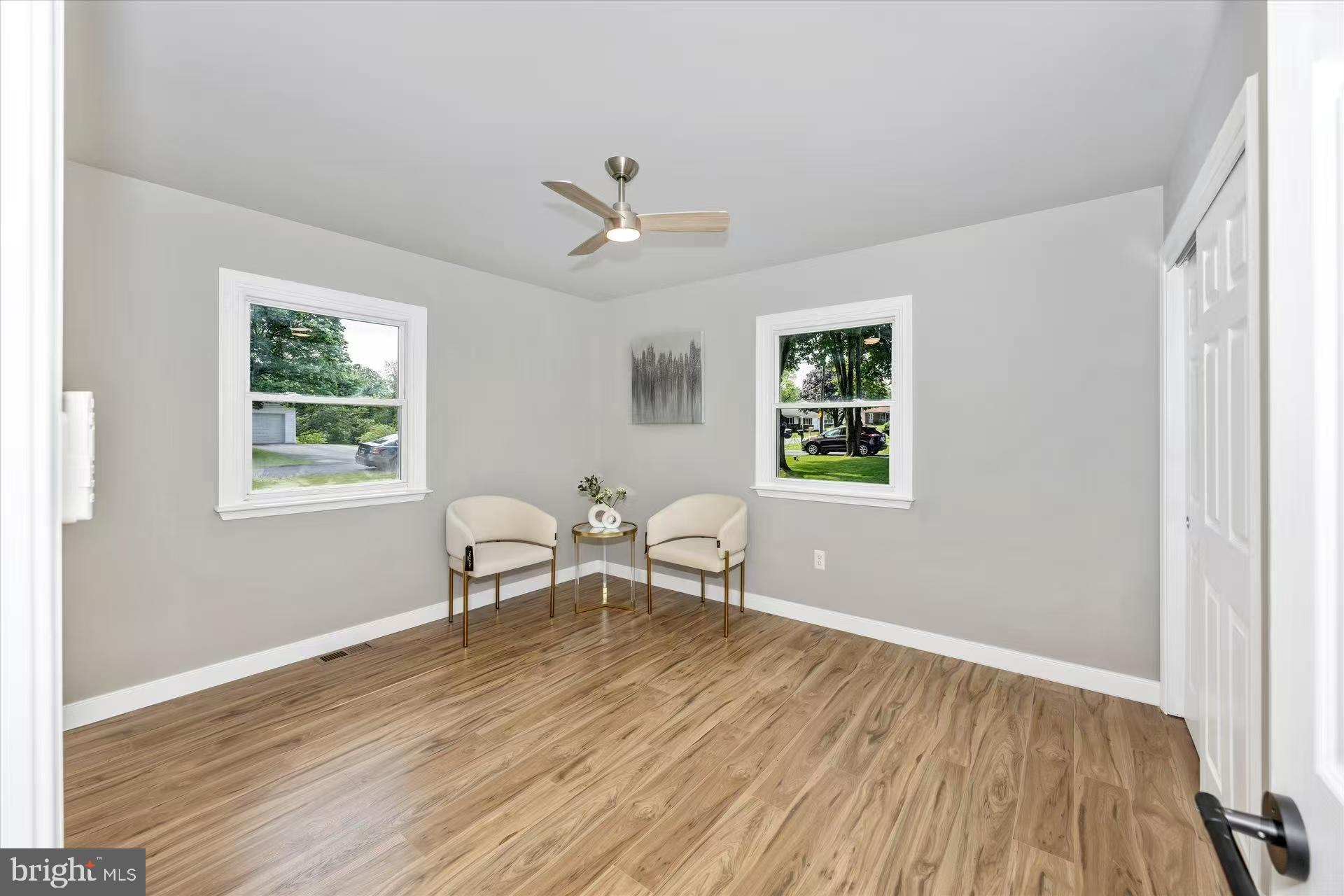 1212 Random Ridge Road Westminster, MD 21157 - Photo 16 of 36 a living room with wooden floor and a window