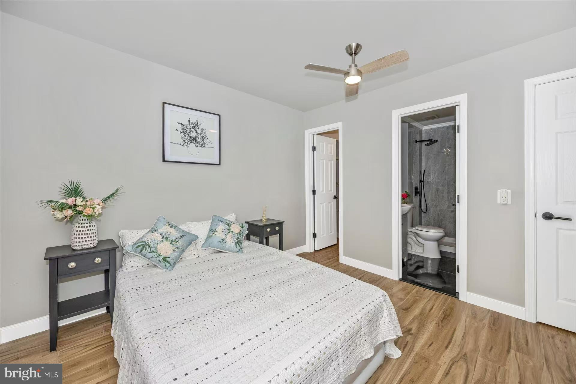 1212 Random Ridge Road Westminster, MD 21157 - Photo 17 of 36 a bedroom with a bed and a table