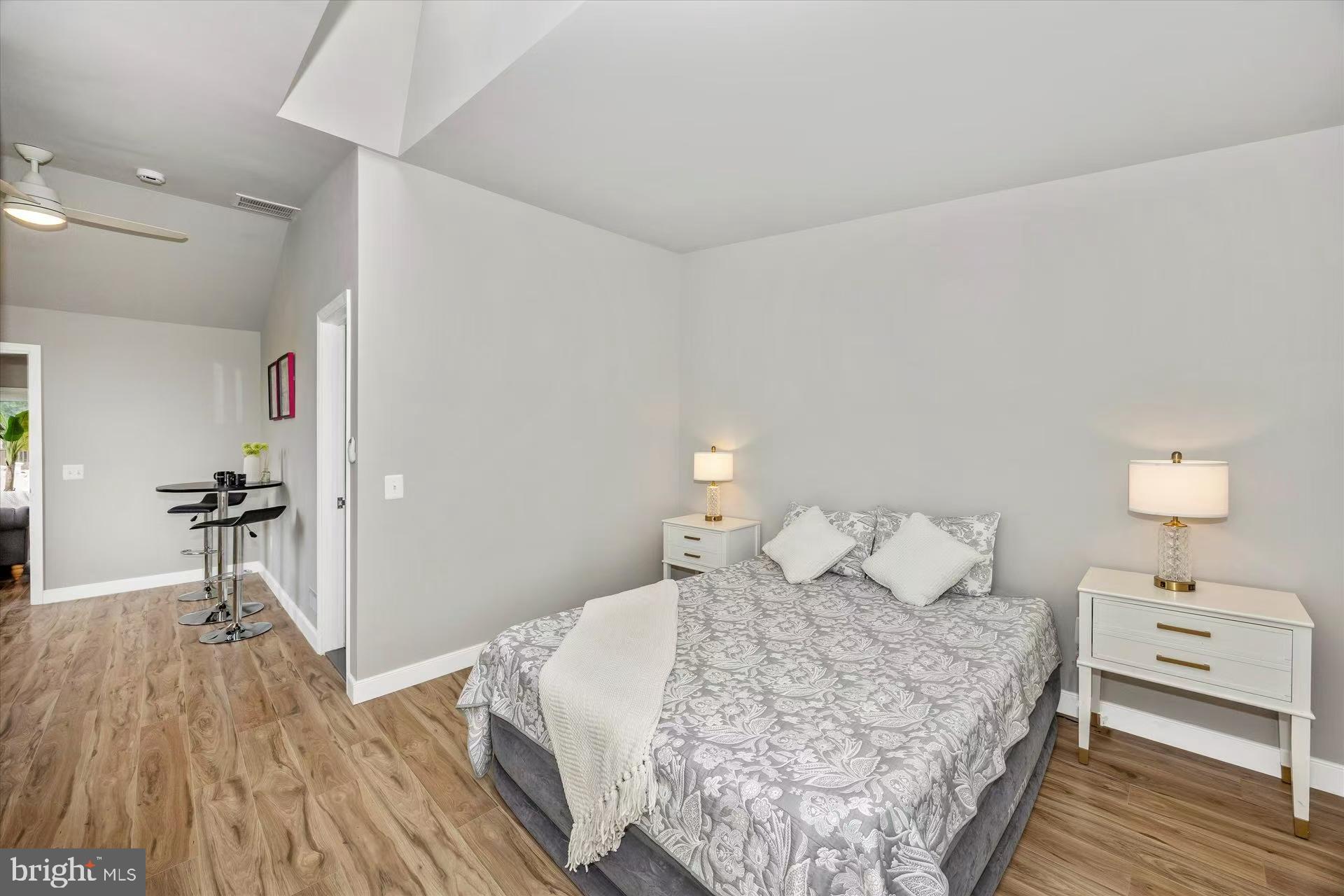 1212 Random Ridge Road Westminster, MD 21157 - Photo 19 of 36 a bedroom with a bed and a table