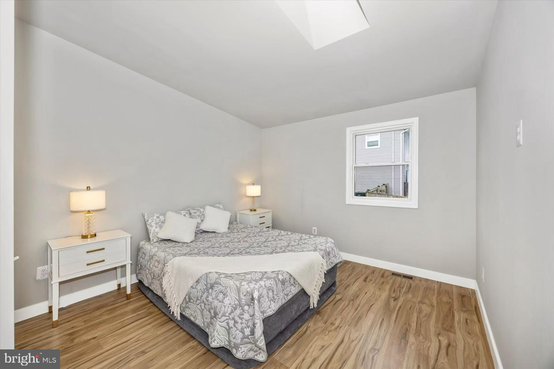 1212 Random Ridge Road Westminster, MD 21157 - Photo 20 of 36 a bedroom with a bed and a night stand