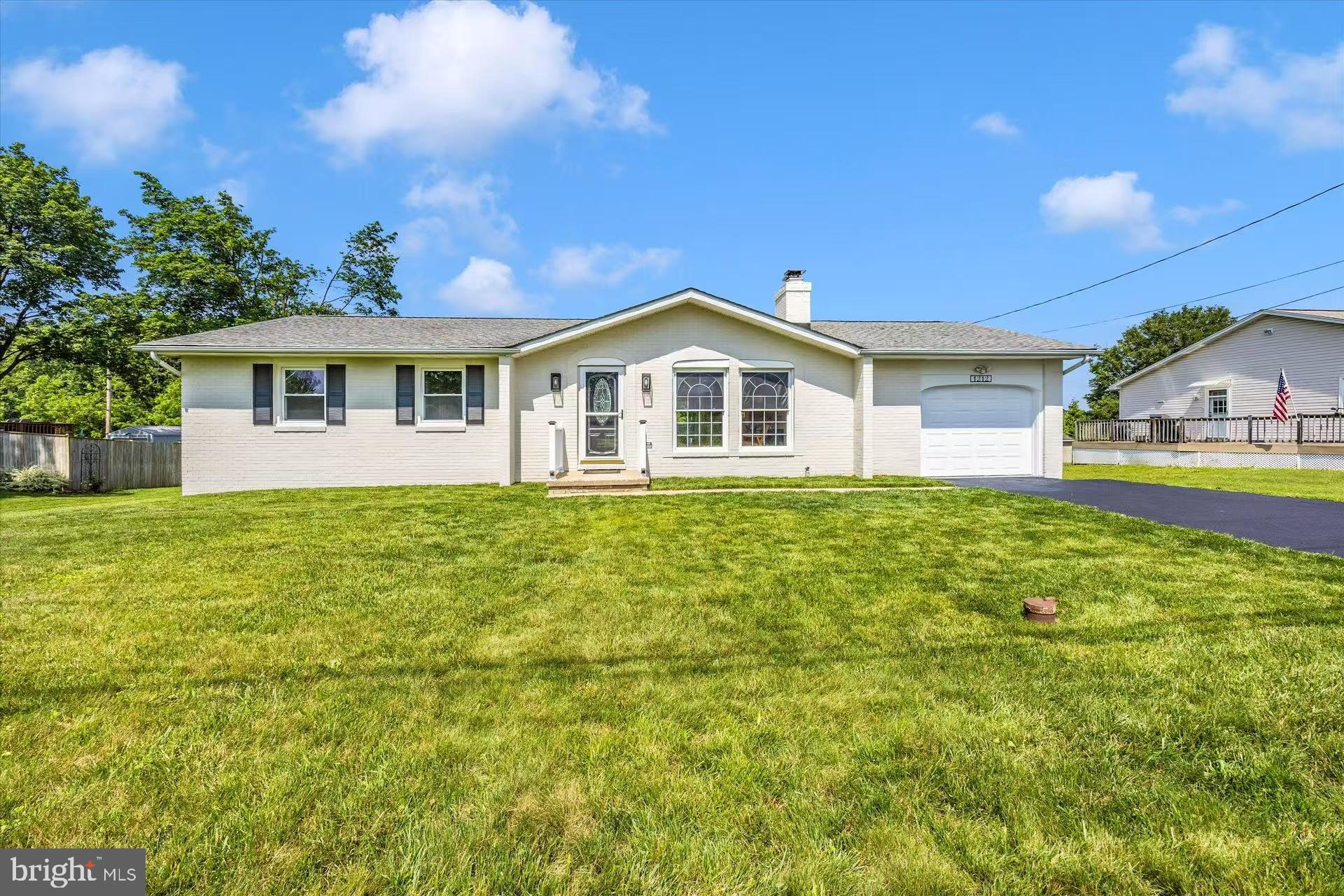 1212 Random Ridge Road Westminster, MD 21157 - Photo 2 of 36 a front view of a house with garden