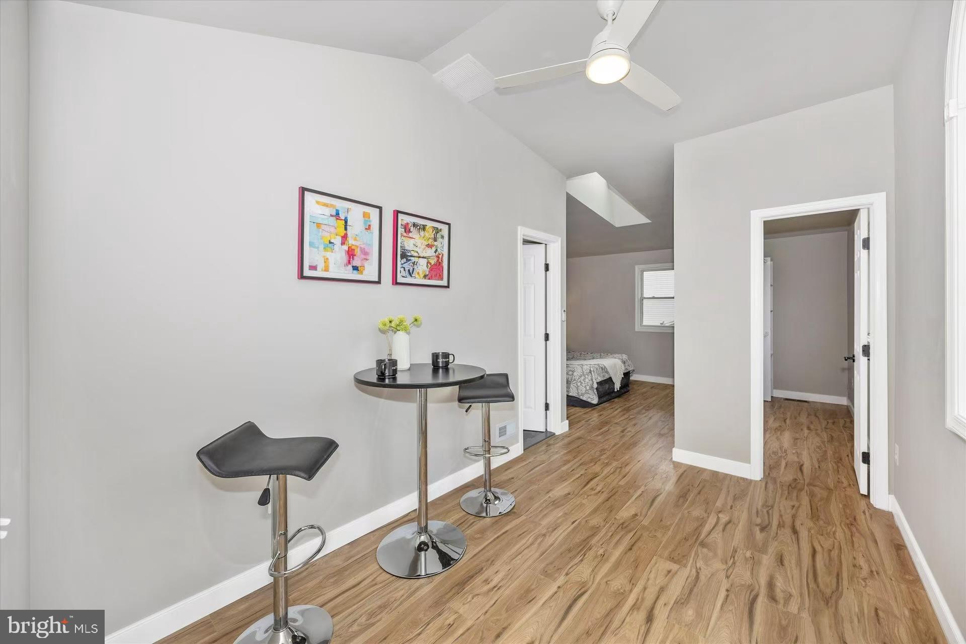 1212 Random Ridge Road Westminster, MD 21157 - Photo 22 of 36 a living room with furniture and a wooden floor