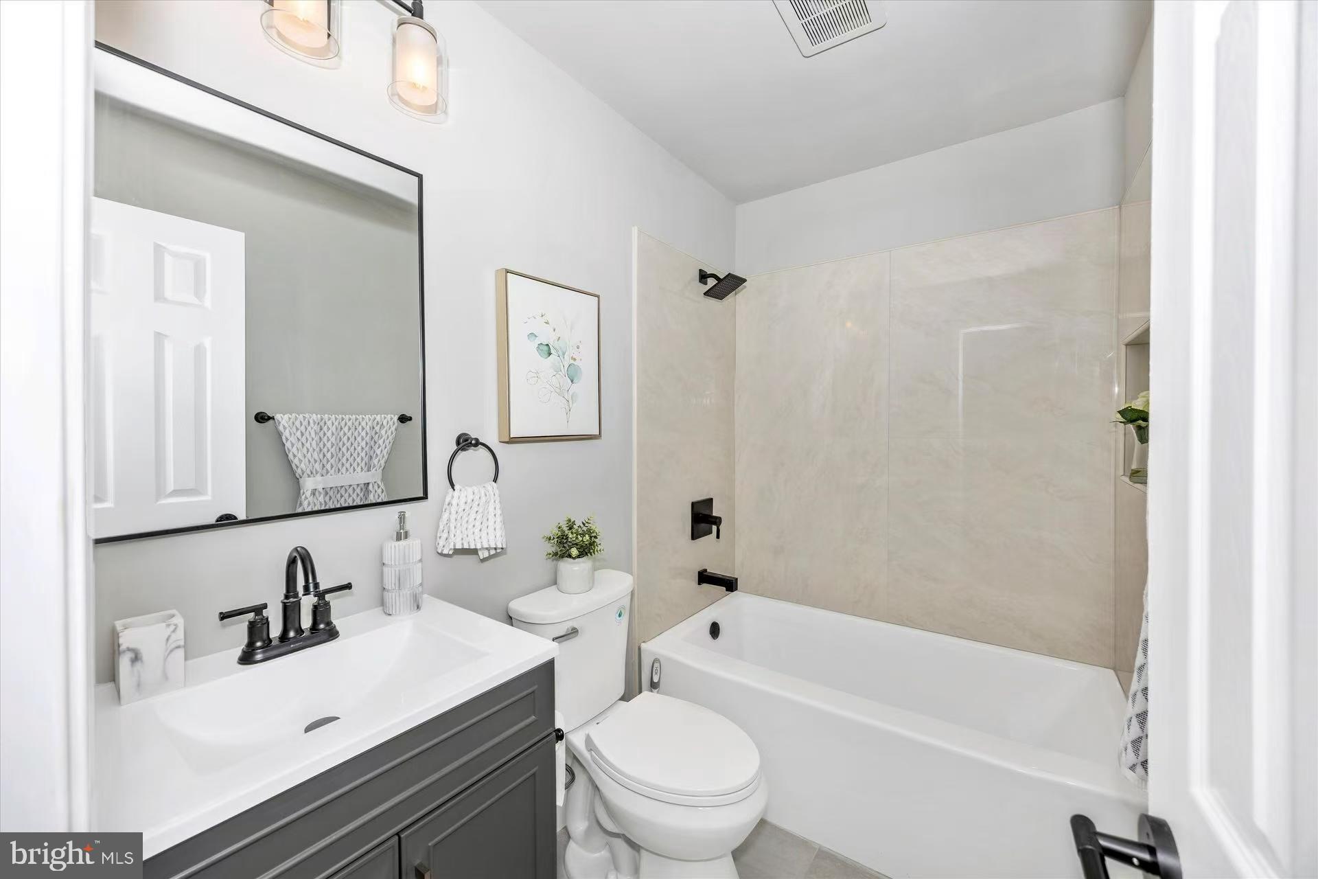 1212 Random Ridge Road Westminster, MD 21157 - Photo 23 of 36 a bathroom with a bathtub shower sink vanity mirror and toilet