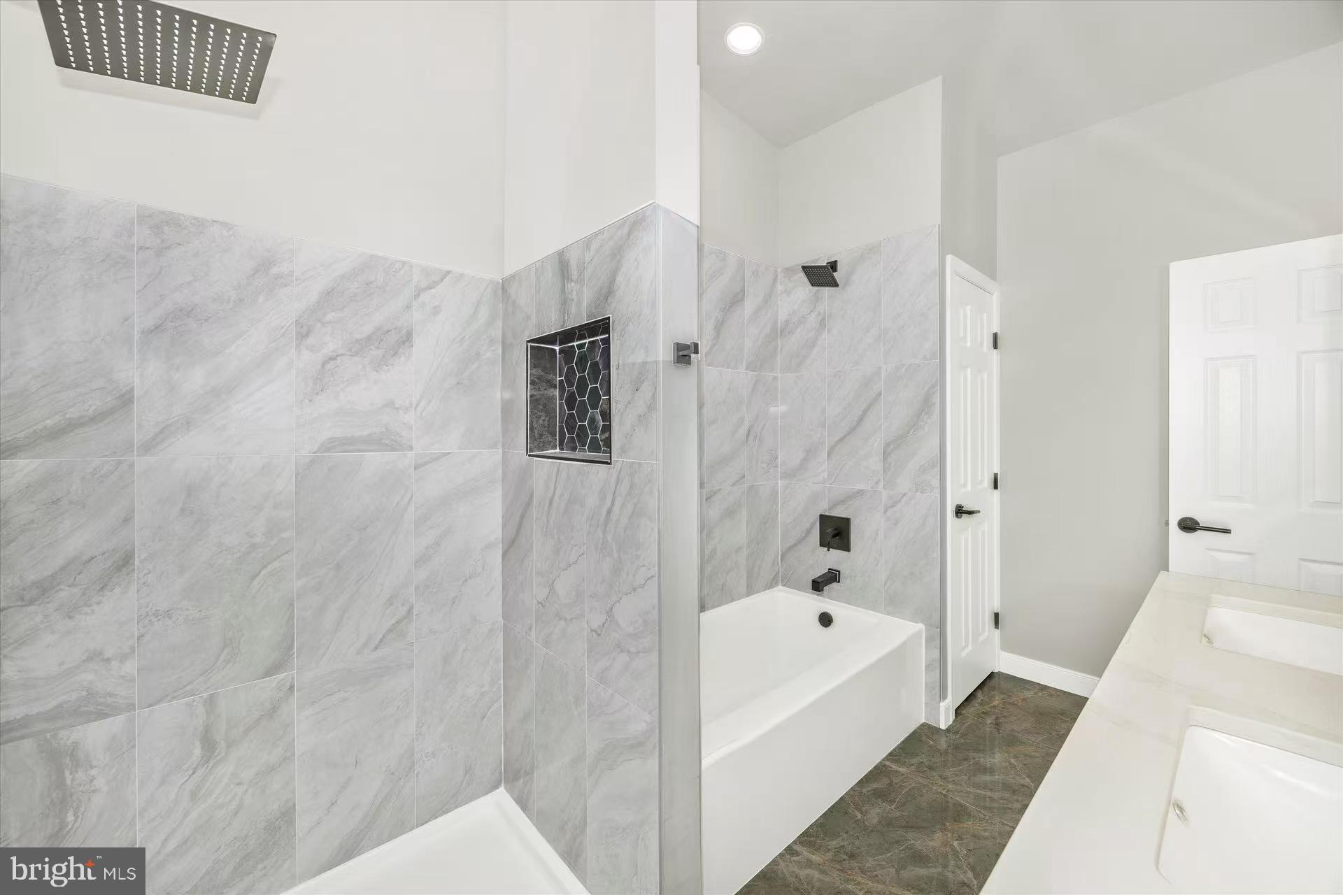 1212 Random Ridge Road Westminster, MD 21157 - Photo 27 of 36 a bathroom with a bathtub and shower