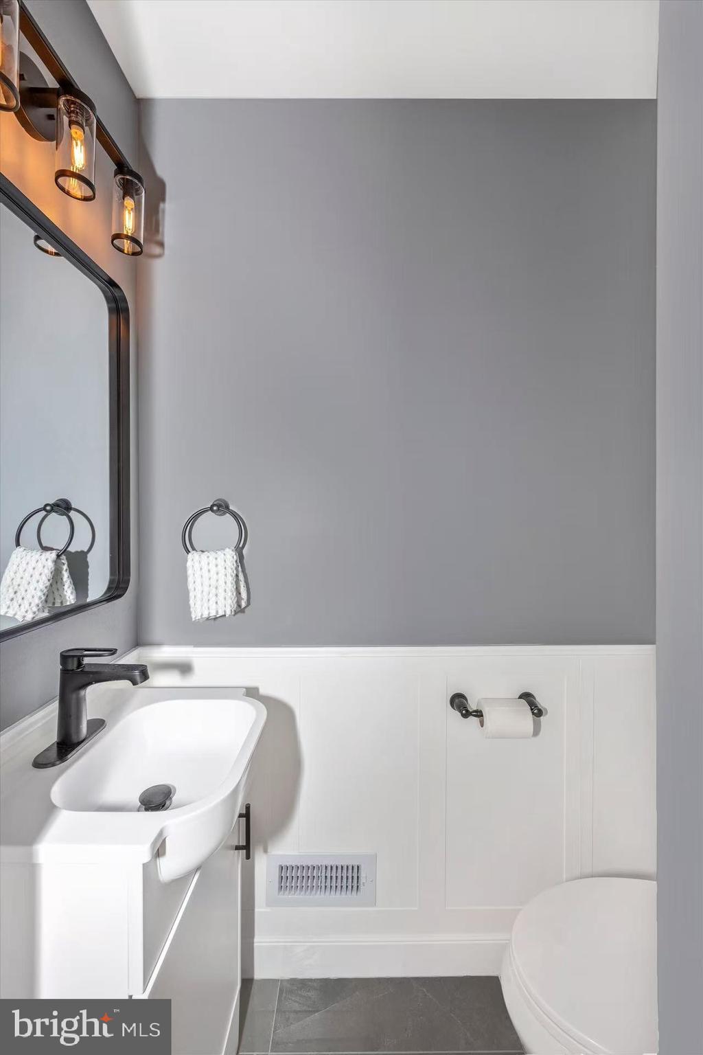 1212 Random Ridge Road Westminster, MD 21157 - Photo 29 of 36 a bathroom with a sink and a mirror