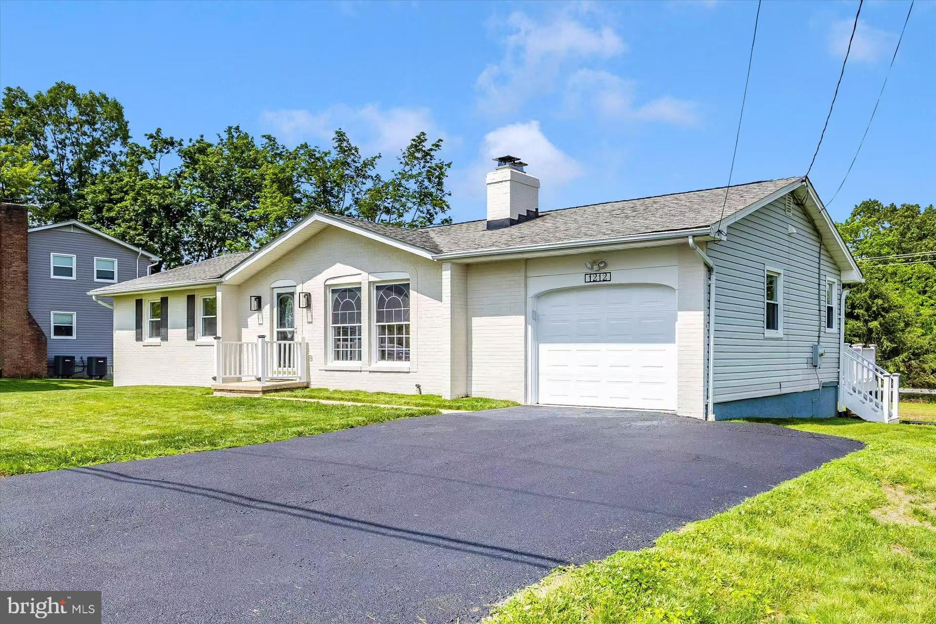 1212 Random Ridge Road Westminster, MD 21157 - Photo 4 of 36 a yellow and red house with a yard