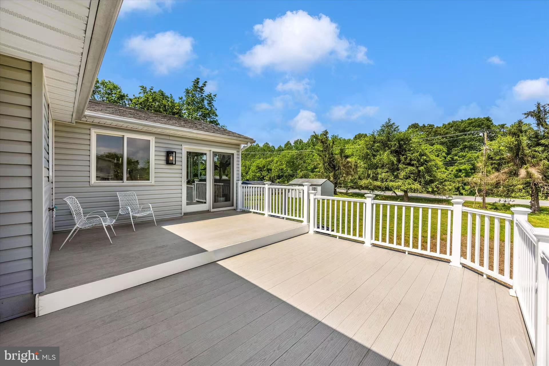 1212 Random Ridge Road Westminster, MD 21157 - Photo 5 of 36 a view of a patio with a table and chairs