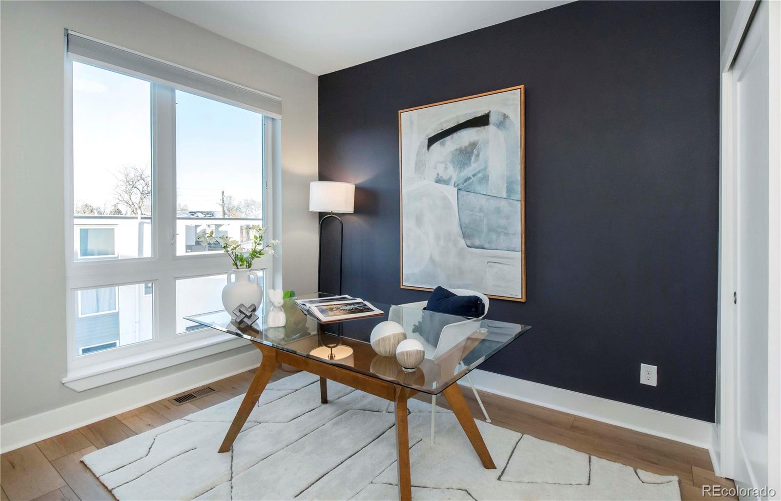 1933 Grove Street Denver, CO 80204 - Photo 20 of 29 a workspace room with furniture and a window