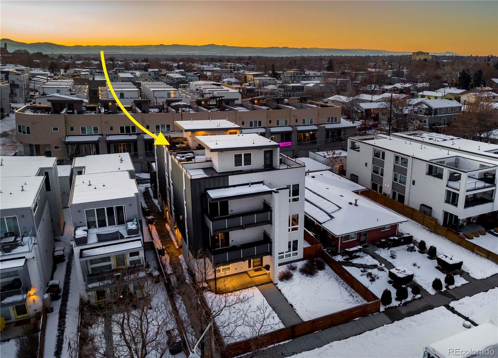 1933 Grove Street Denver, CO 80204 - Photo 2 of 29 an aerial view of a building with outdoor space