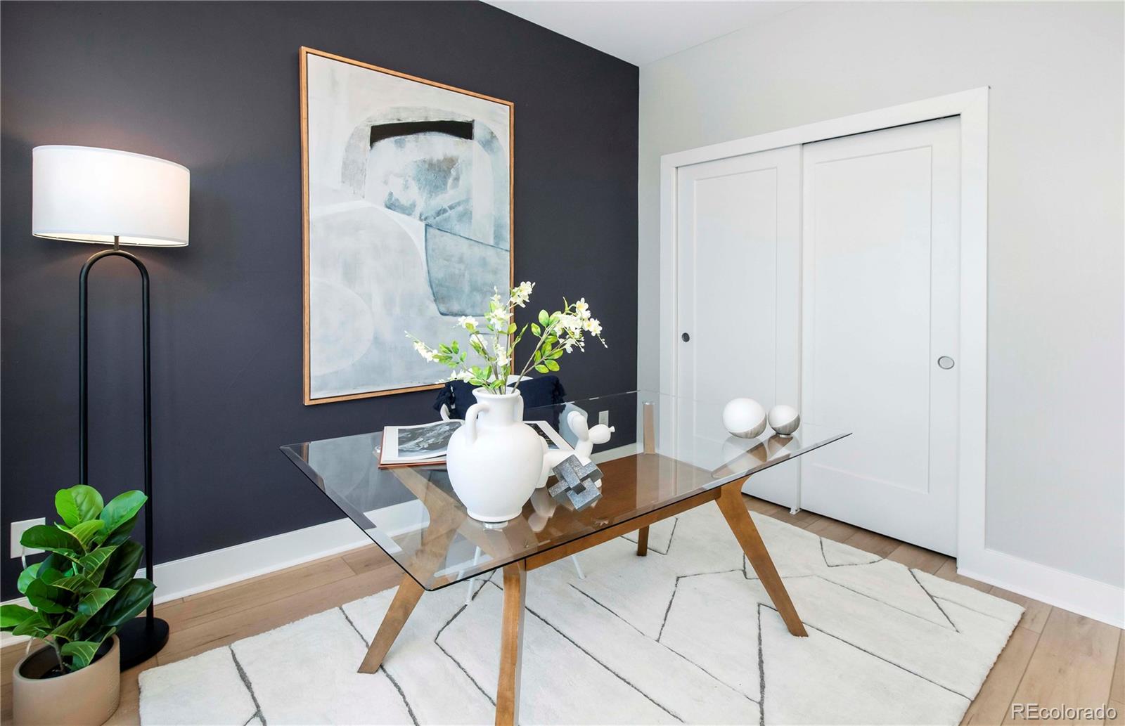 1933 Grove Street Denver, CO 80204 - Photo 21 of 29 a dining room with furniture and wooden floor