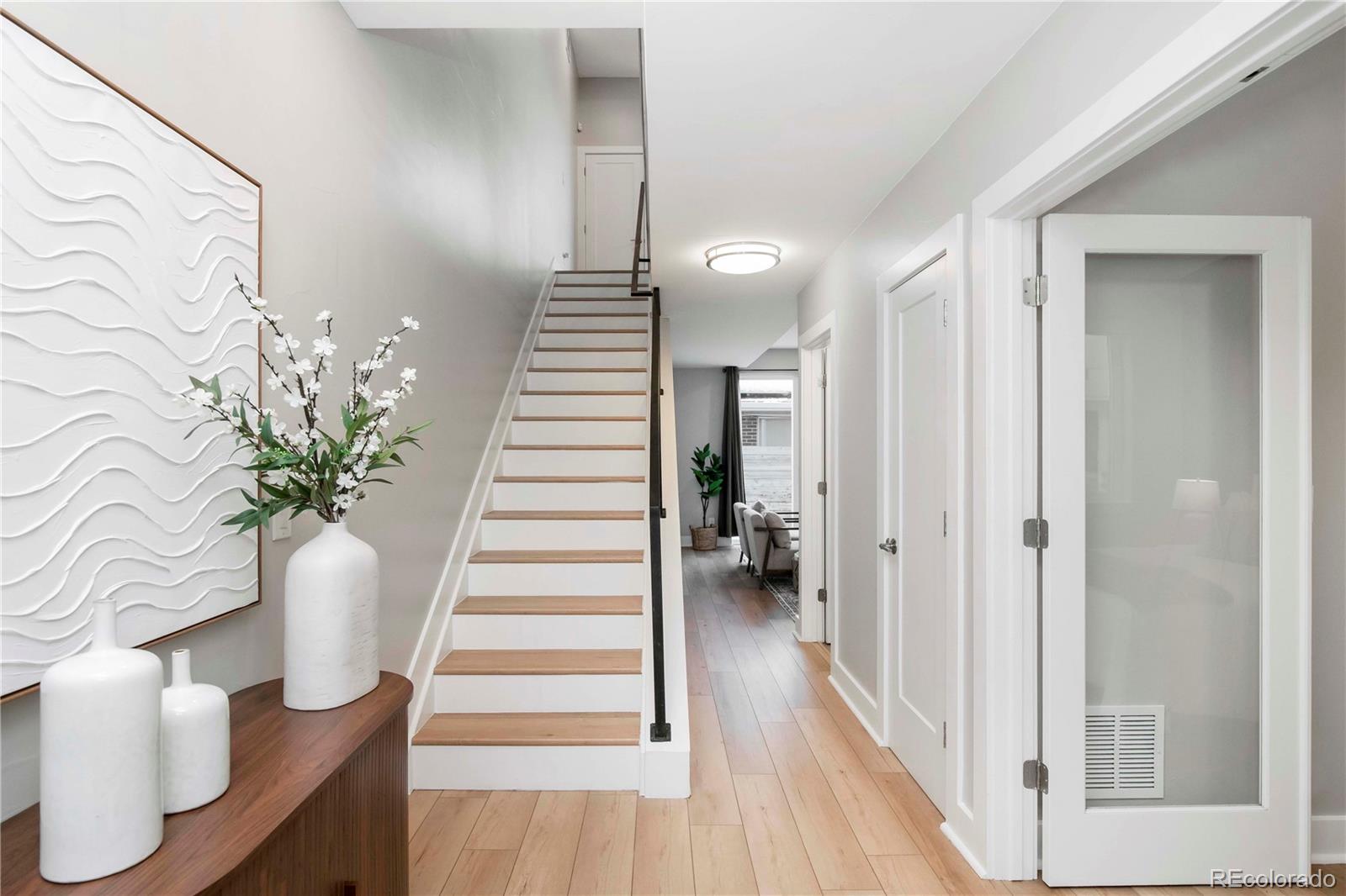 1933 Grove Street Denver, CO 80204 - Photo 5 of 29 a view of a hallway with wooden floor and entryway