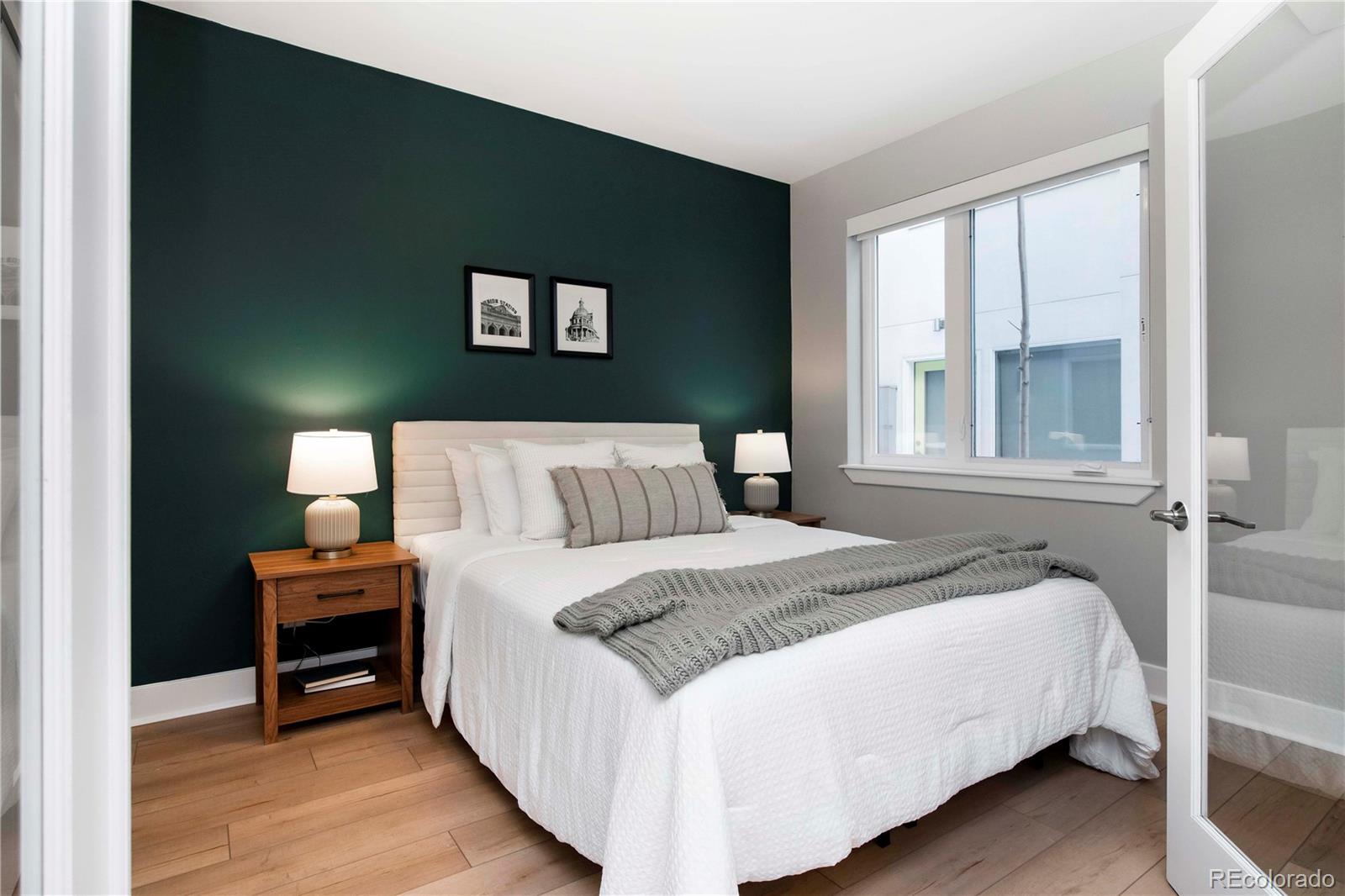 1933 Grove Street Denver, CO 80204 - Photo 7 of 29 a bedroom with a bed and a window