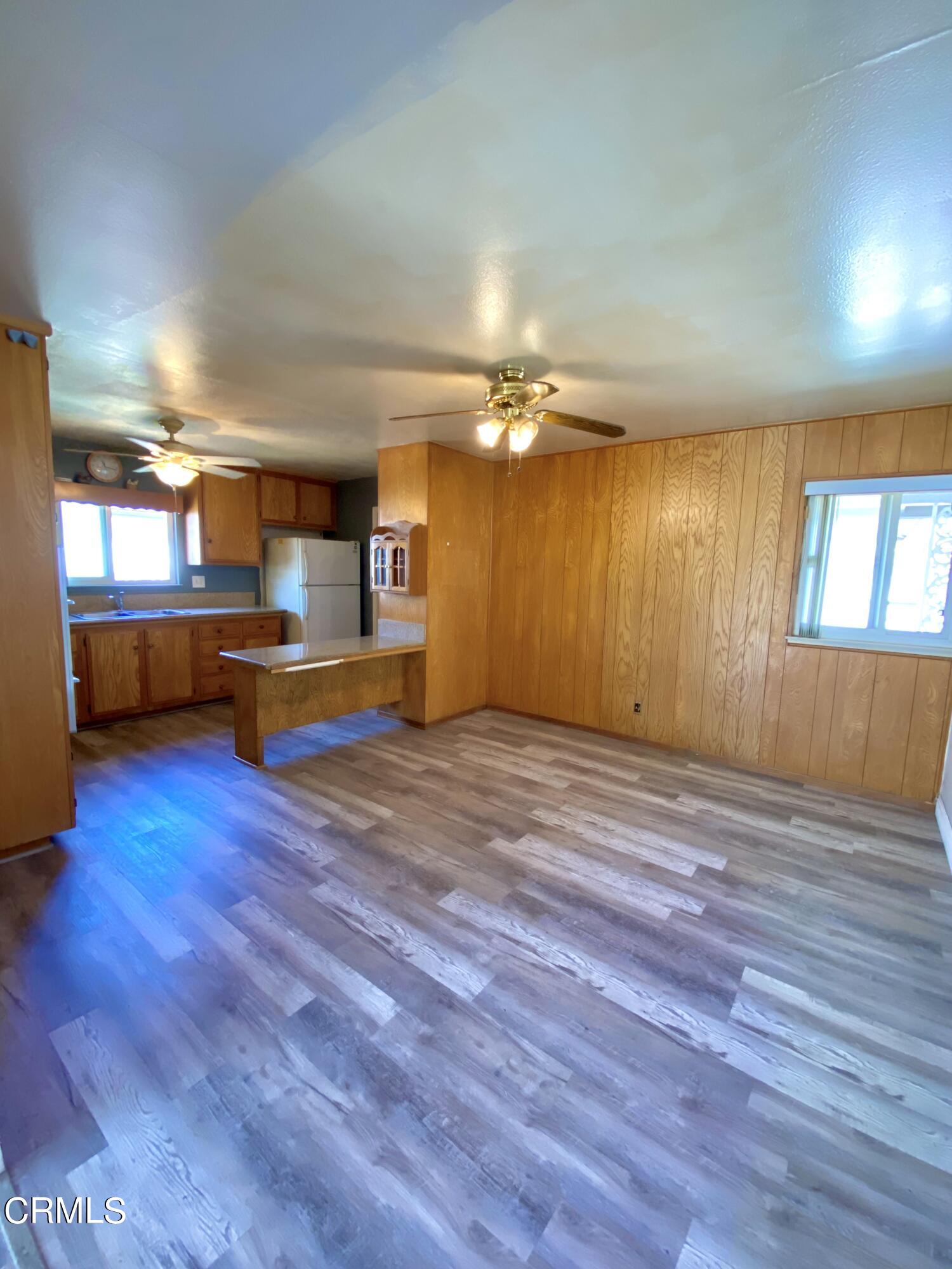 930 West Olive Street Oxnard, CA 93033 - Photo 6 of 22 a view of a room with wooden floor