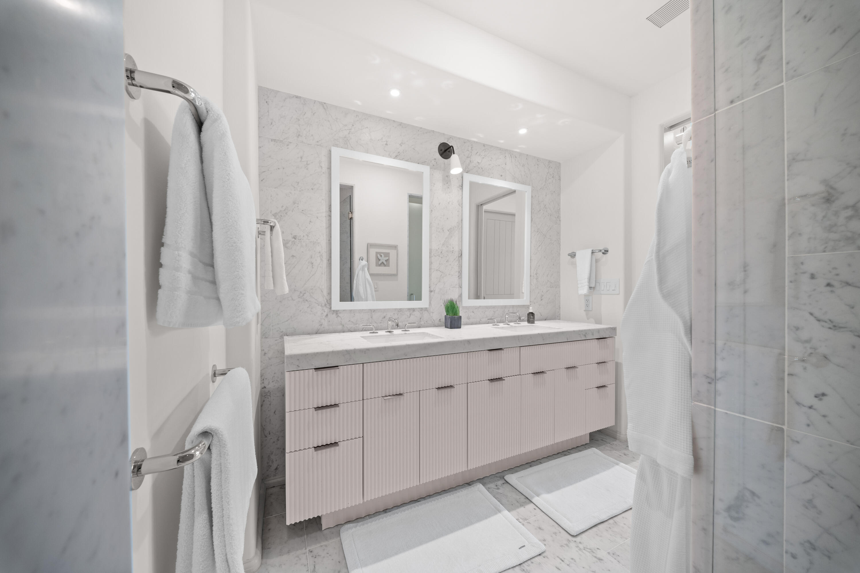 45 West Solaire Way Inlet Beach, Unit 107 Inlet Beach, FL 32461 - Photo 12 of 47 a bathroom with double vanity sink and a mirror