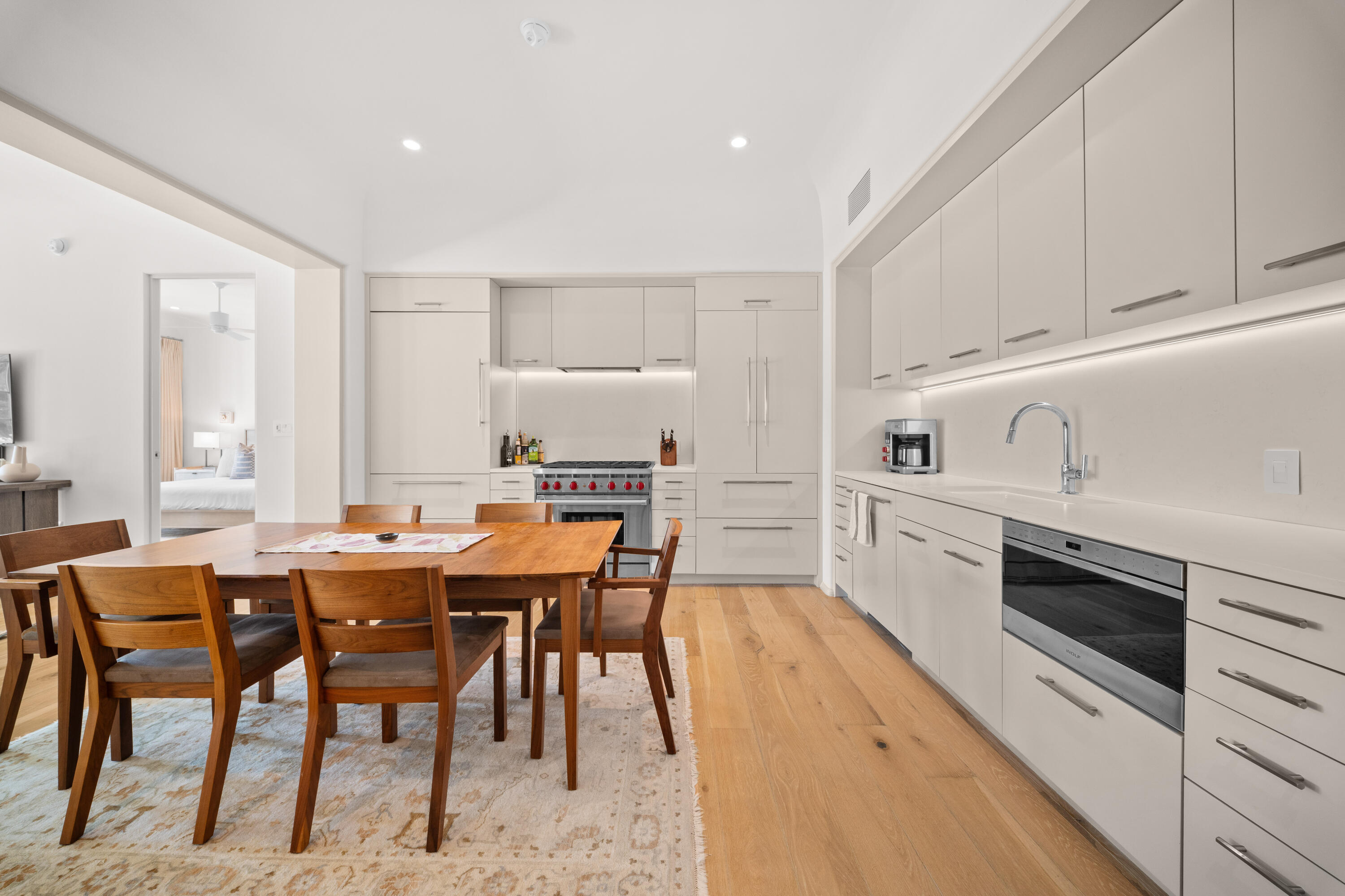 45 West Solaire Way Inlet Beach, Unit 107 Inlet Beach, FL 32461 - Photo 23 of 47 a kitchen with appliances cabinets and chair