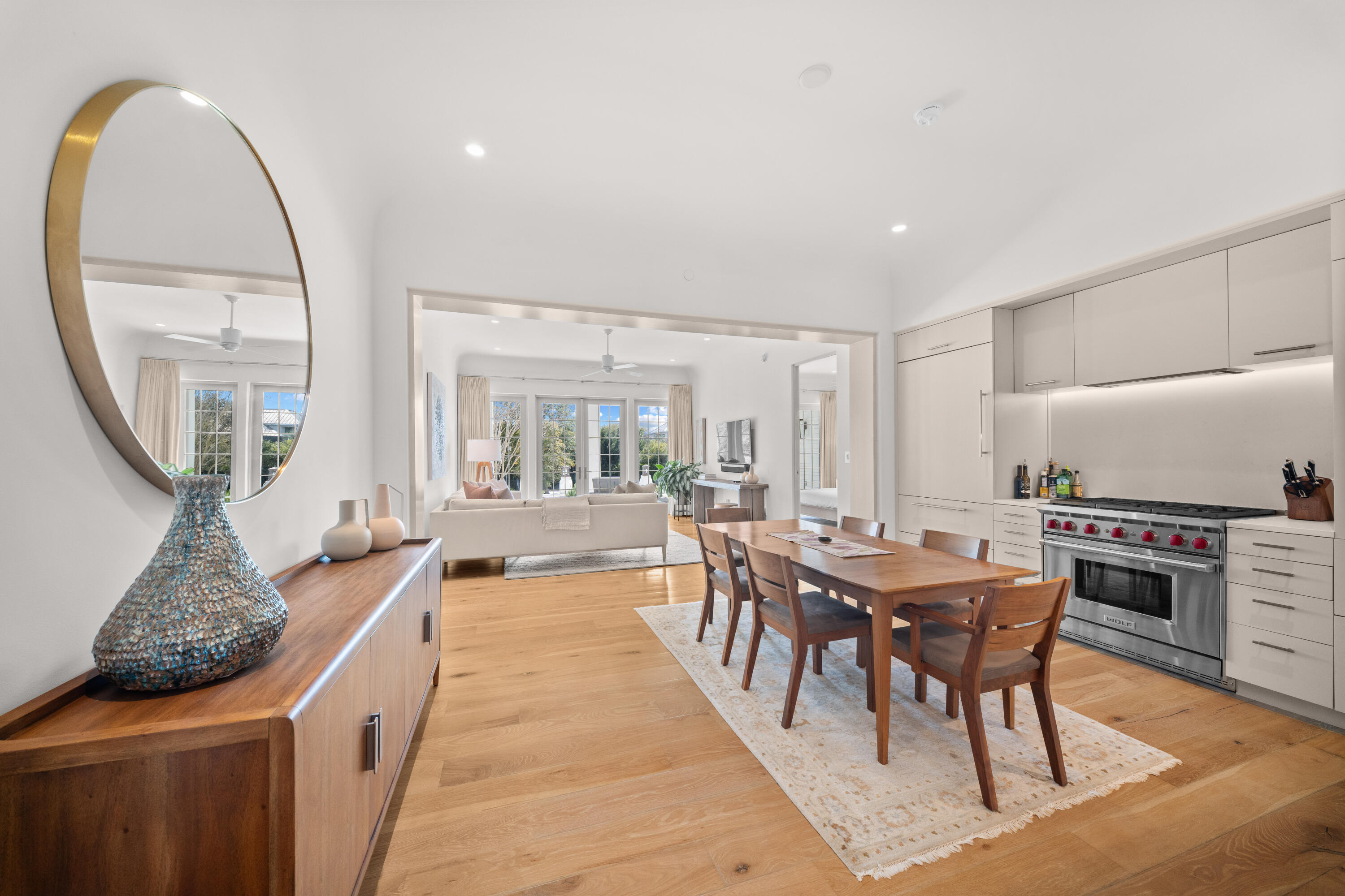 45 West Solaire Way Inlet Beach, Unit 107 Inlet Beach, FL 32461 - Photo 25 of 47 a dining hall with stainless steel appliances granite countertop a stove a sink a dining table and chairs