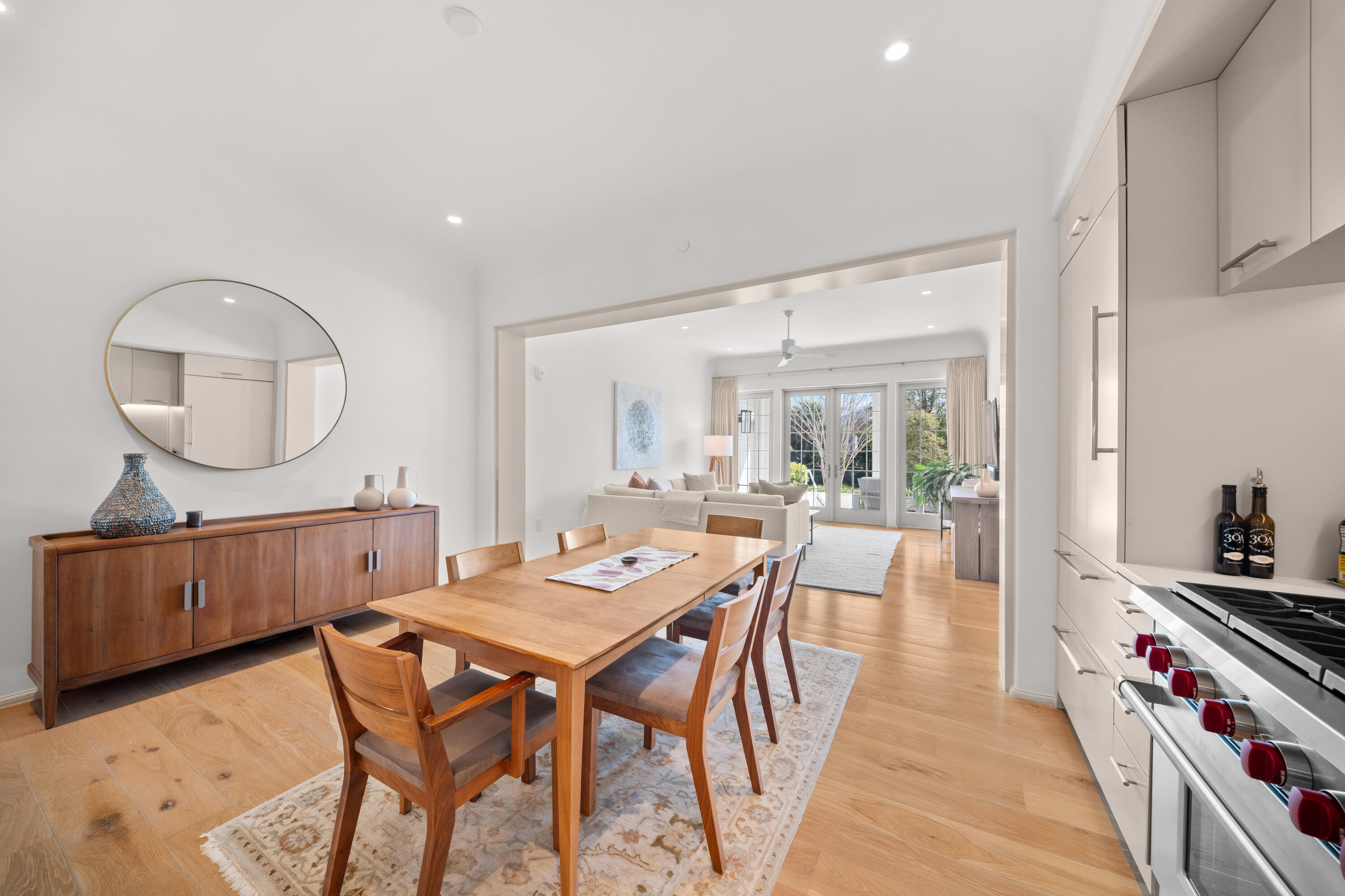 45 West Solaire Way Inlet Beach, Unit 107 Inlet Beach, FL 32461 - Photo 27 of 47 a dining room with wooden floor a glass table and chairs