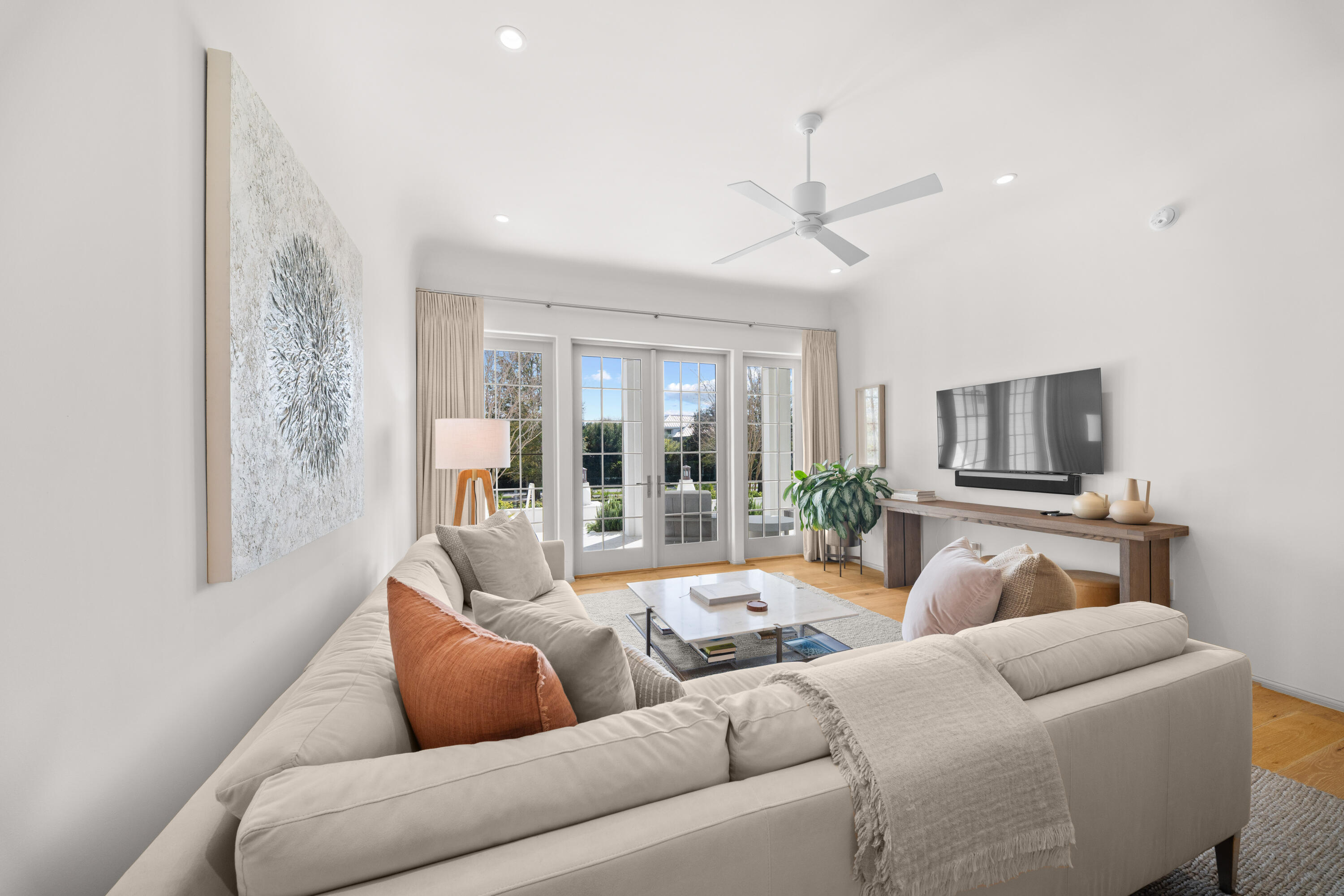 45 West Solaire Way Inlet Beach, Unit 107 Inlet Beach, FL 32461 - Photo 30 of 47 a living room with furniture ceiling fan and a window