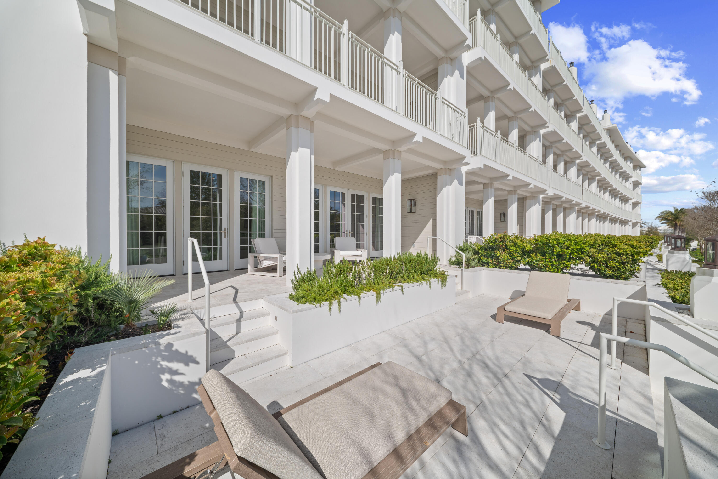 45 West Solaire Way Inlet Beach, Unit 107 Inlet Beach, FL 32461 - Photo 35 of 47 a view of a house with backyard and sitting area
