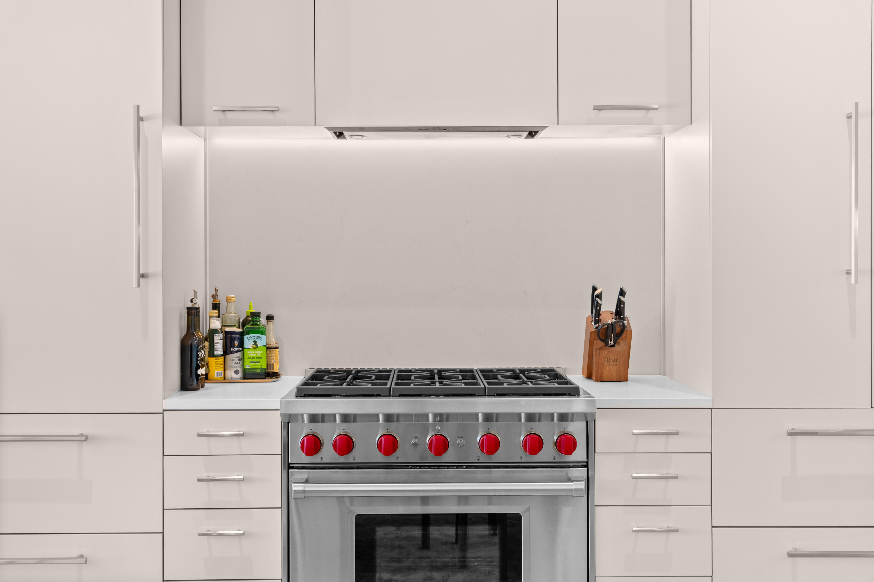 45 West Solaire Way Inlet Beach, Unit 107 Inlet Beach, FL 32461 - Photo 36 of 47 a kitchen with a stove and a white cabinets