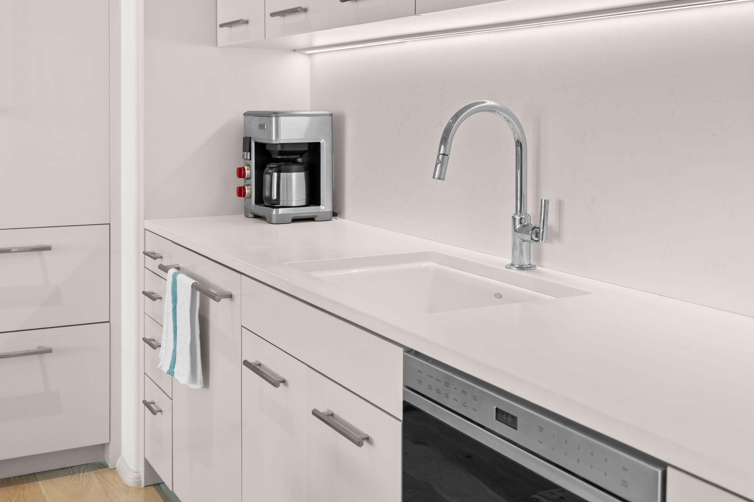 45 West Solaire Way Inlet Beach, Unit 107 Inlet Beach, FL 32461 - Photo 37 of 47 a kitchen with a sink and a refrigerator