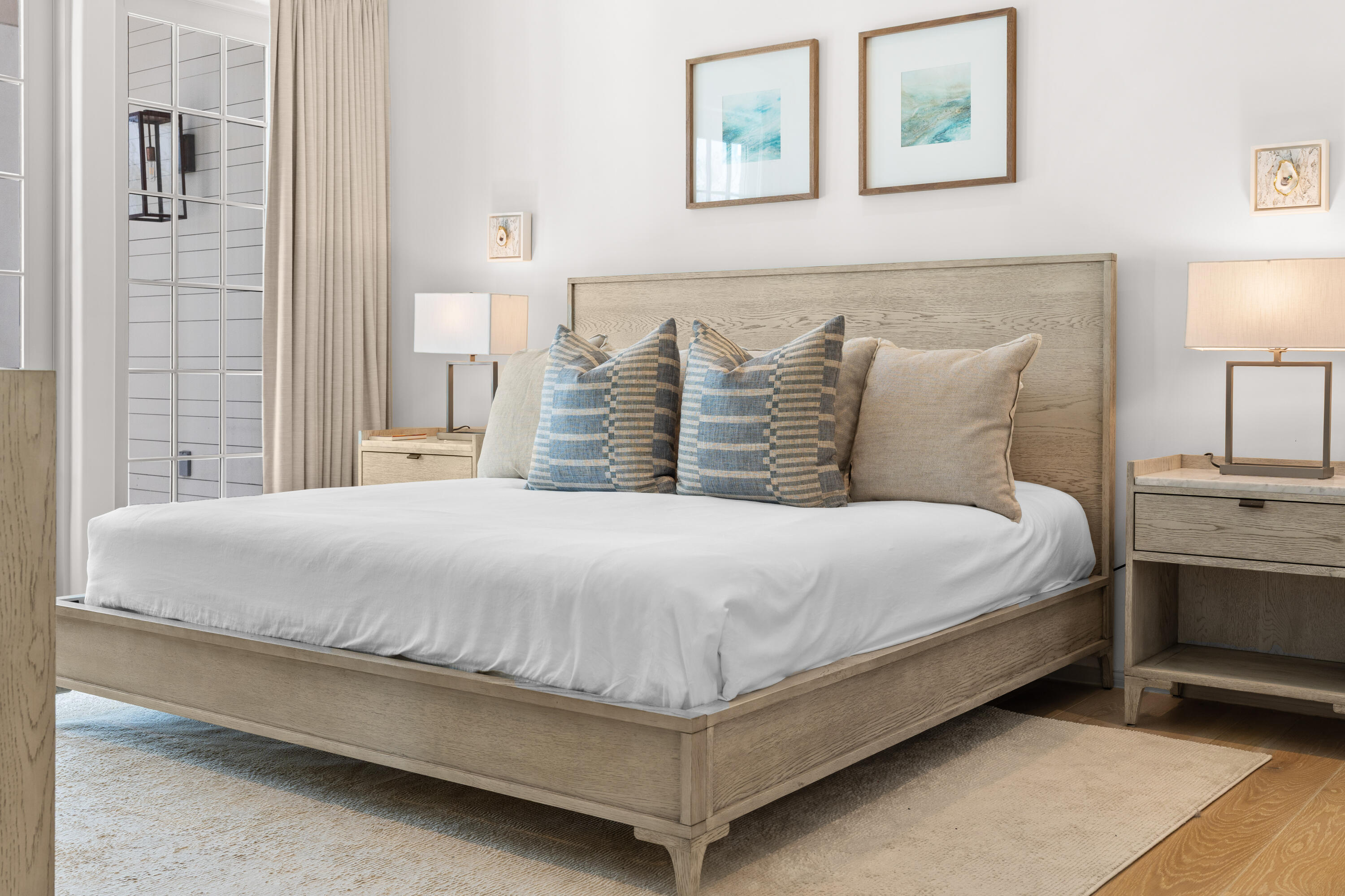 45 West Solaire Way Inlet Beach, Unit 107 Inlet Beach, FL 32461 - Photo 39 of 47 a large bed sitting in a bedroom next to a lamp