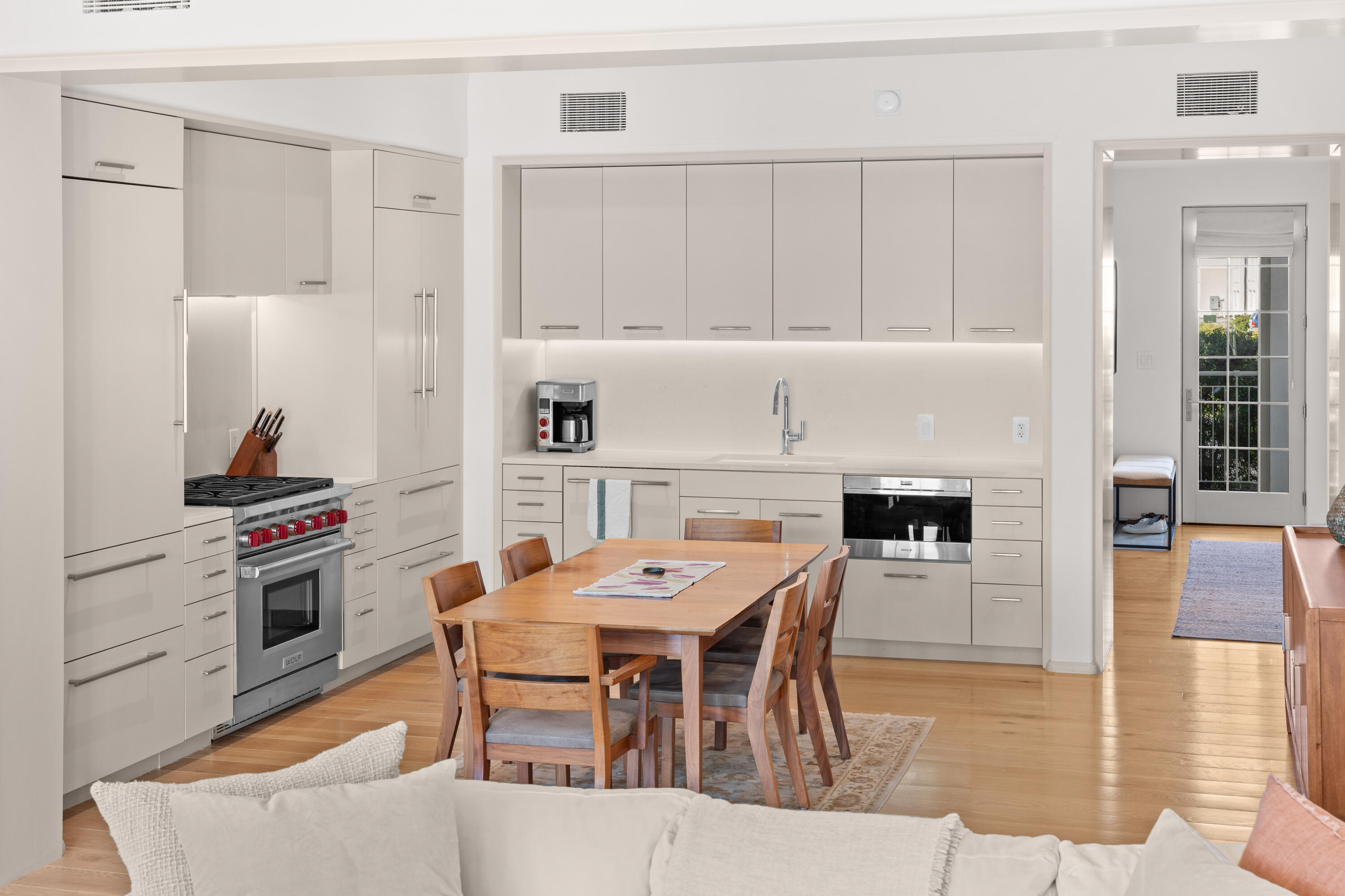 45 West Solaire Way Inlet Beach, Unit 107 Inlet Beach, FL 32461 - Photo 40 of 47 a view of a dining room with furniture and wooden floor