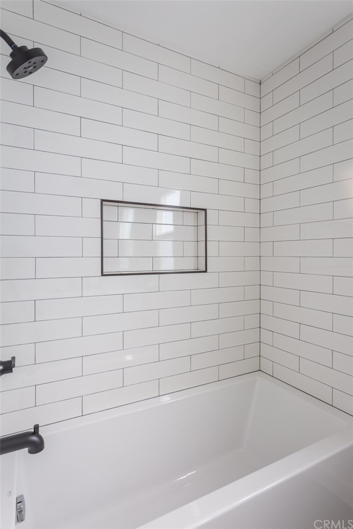 2589 El Sol Avenue Altadena, CA 91001 - Photo 15 of 28 a bathroom with a bathtub and a shower