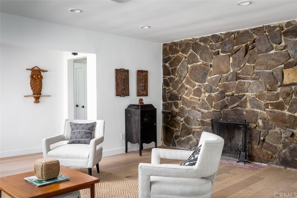 2589 El Sol Avenue Altadena, CA 91001 - Photo 7 of 28 a living room with furniture and a fireplace