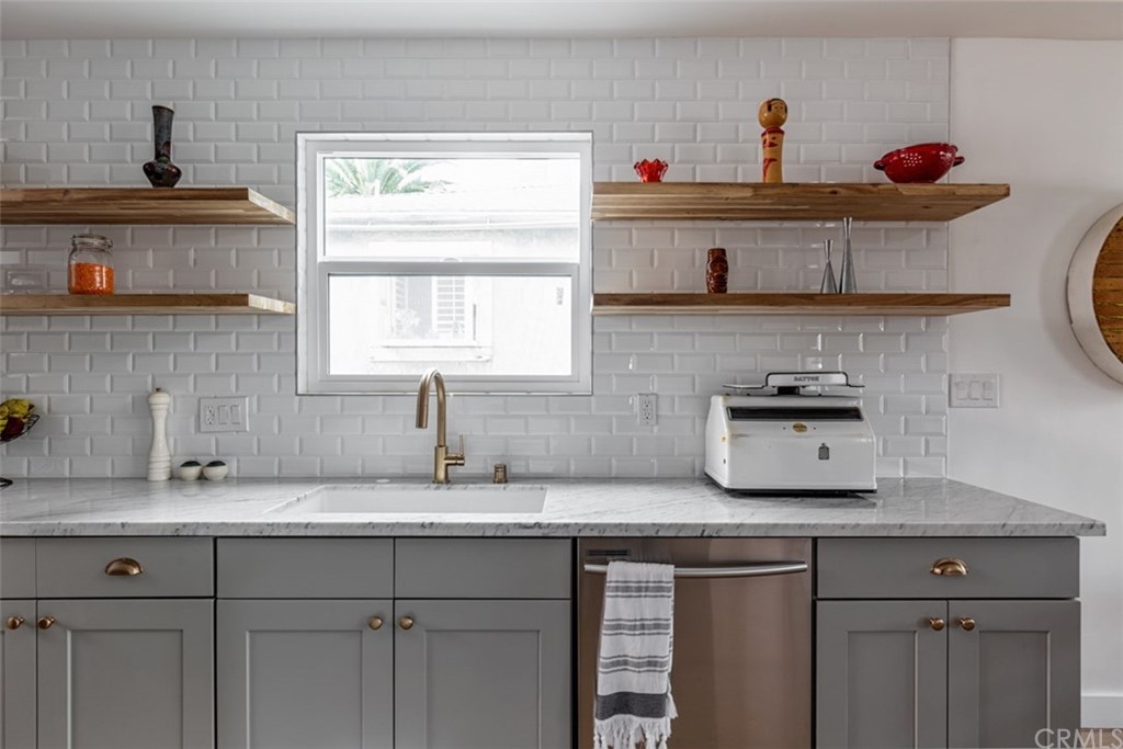 2589 El Sol Avenue Altadena, CA 91001 - Photo 10 of 28 a kitchen with stainless steel appliances a sink and a window