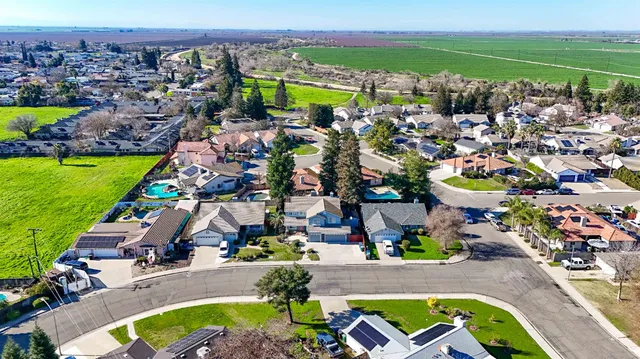 an aerial view of a house with a garden