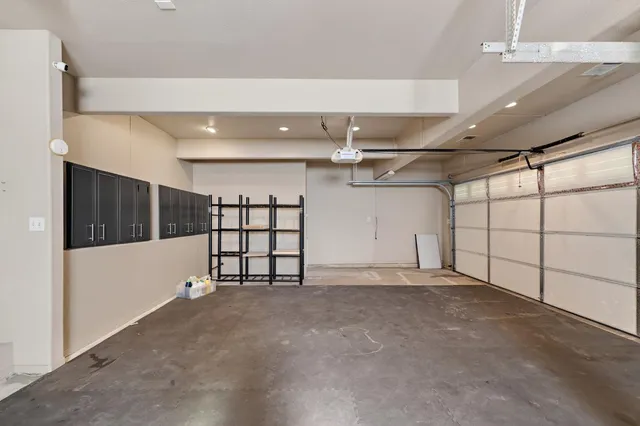 a view of a hallway with a ceiling fan