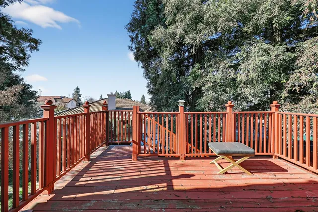 a house with lots of trees in front of it