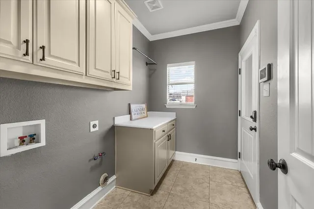 a bathroom with a sink and cabinets