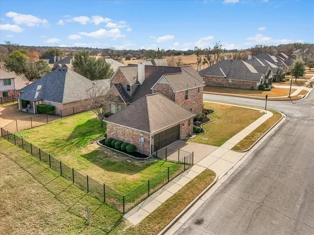 a view of a terrace with chairs and umbrellas