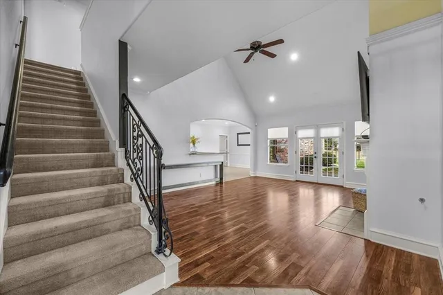 a view of an entryway with wooden floor