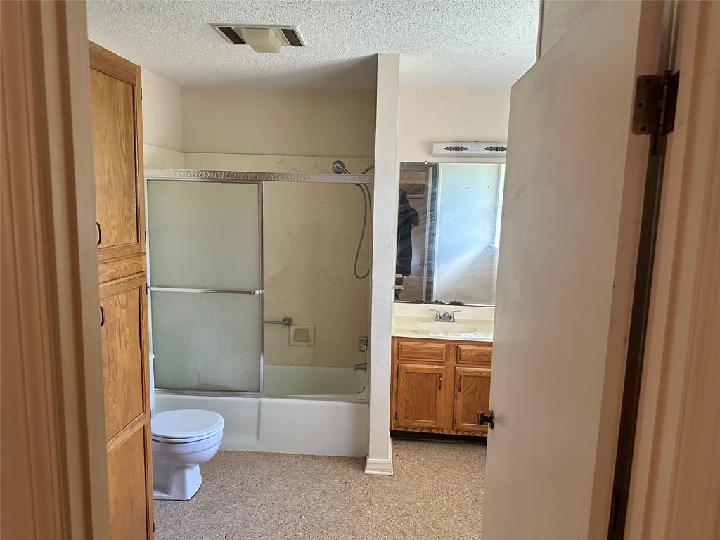 419 Irving Bluff Road Shreveport, LA 71107 - Photo 12 of 19 a bathroom with a granite countertop bathtub shower and toilet