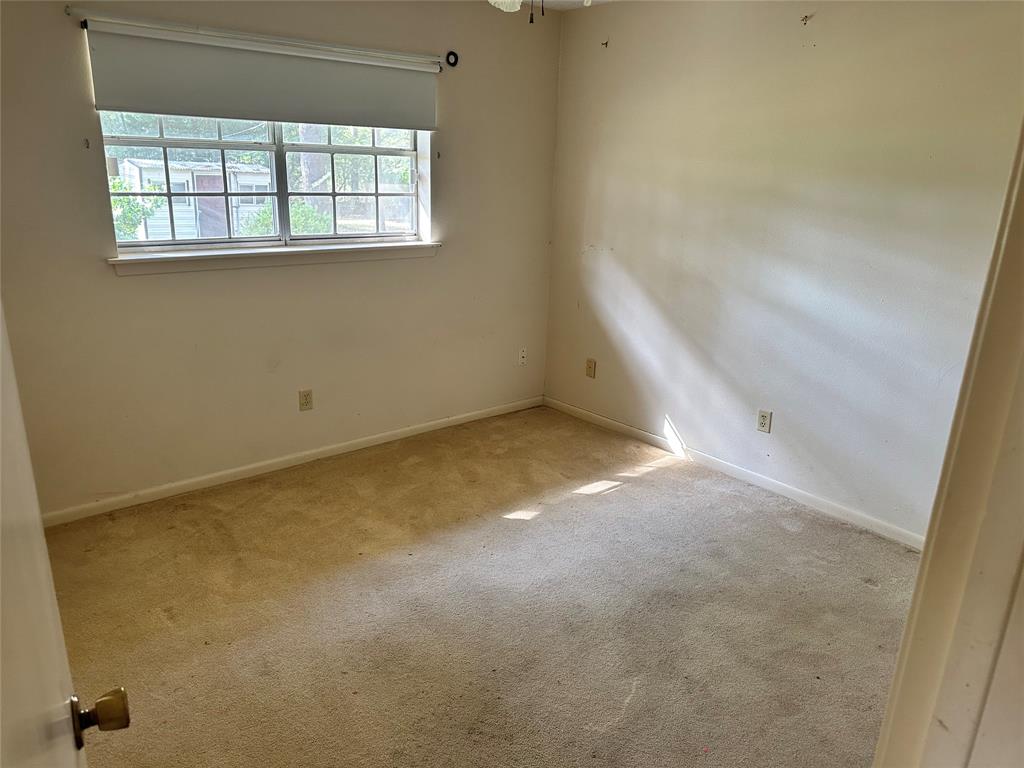 419 Irving Bluff Road Shreveport, LA 71107 - Photo 7 of 19 an empty room with windows