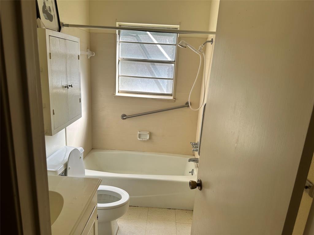 419 Irving Bluff Road Shreveport, LA 71107 - Photo 9 of 19 a bathroom with a granite countertop bathtub shower and toilet