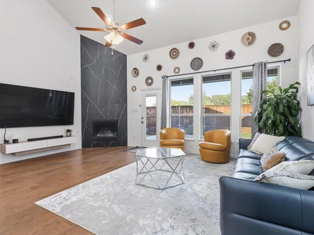 a living room with furniture and a flat screen tv