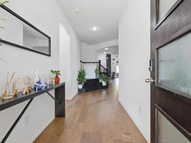 a view of a living room and a potted plant
