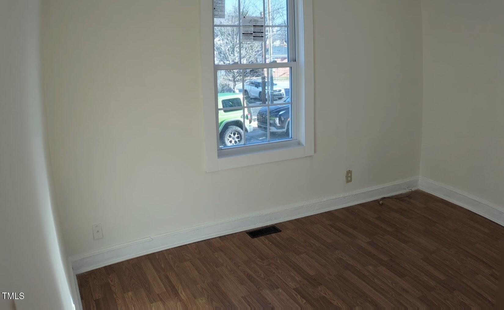 609 North Elizabeth Street, Unit B Durham, NC 27701 - Photo 5 of 11 a view of a room with wooden floor and window