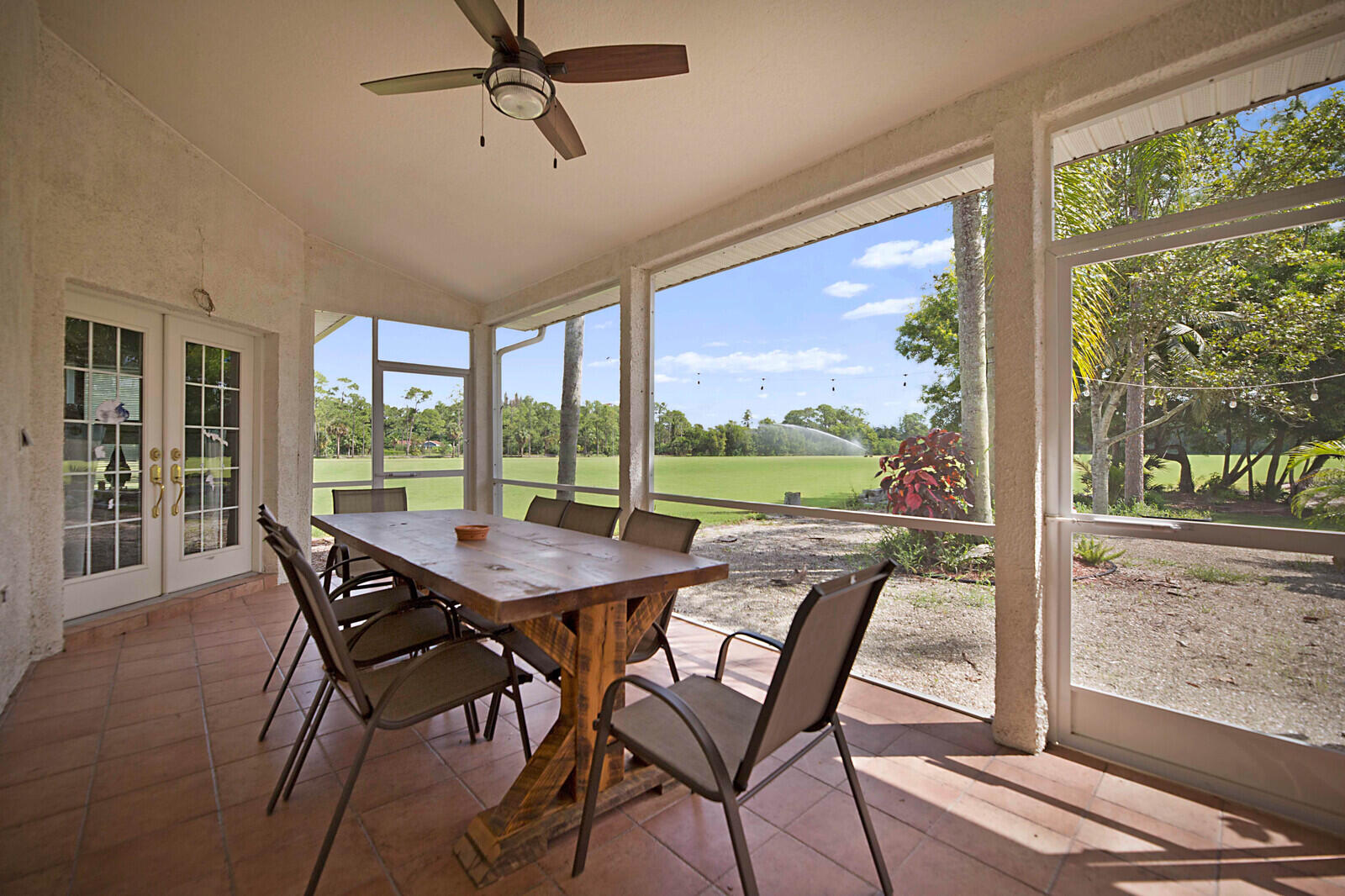 1472-1538 E Road Loxahatchee, FL 33470 - Photo 37 of 42 SCREENED PORCH FROM MASTER & LIVING ROOM